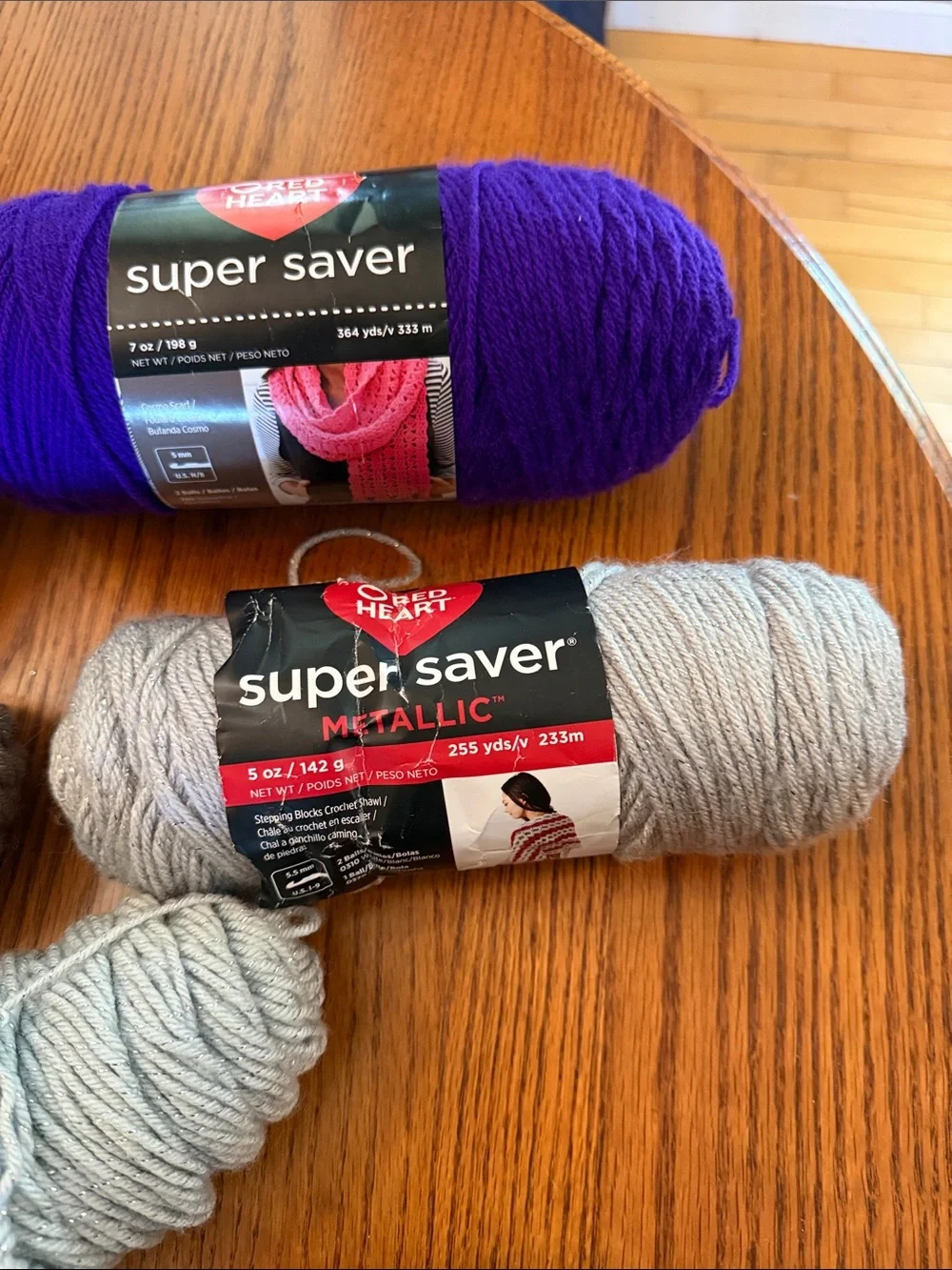 Super Saver Yarn Bundle in Purple, Black, white, gray metallic, and brown.